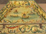 a box with a painting on it sitting on a table