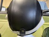 a helmet on top of a helmet on a stand