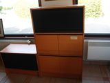 a television that is sitting on top of a cabinet