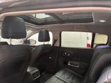 the interior of a car with the sunroof down and the back seats down