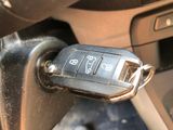 a close up of a car key on a car ' s dashboard