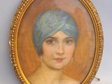 painting of a woman with a blue turban in a gold frame