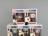 several pop vinyl figures are stacked on top of each other on a table