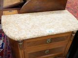 a small wooden table with a marble top on it