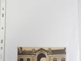a picture of a picture of a building with a horse drawn carriage