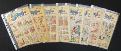 a lot of comic books on a black table