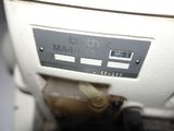 a close up of a machine with a clock on it