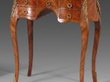 an antique wooden table with two drawers and two drawers