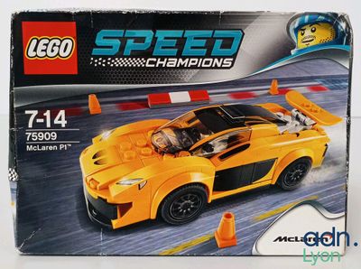 a box of lego speed champions with a yellow sports car