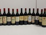 several bottles of wine are lined up on a table