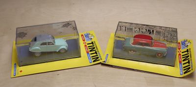 two toy cars that are sitting on a table