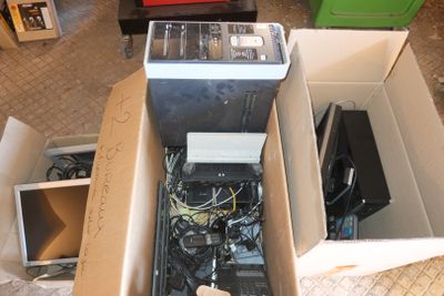 a box full of electronic equipment sitting on the floor