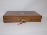 a small wooden box with a lock on it