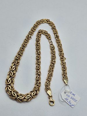 a close up of a gold chain with a tag on it