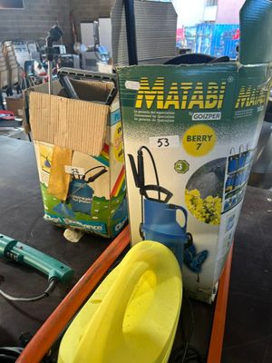 a yellow boat sitting on a table next to a box