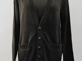a black cardigan sweater sitting on top of a mannequin mannequin