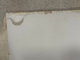 a piece of paper that has been torn off of the wall
