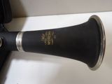 a black and gold trumpet sitting on a white counter