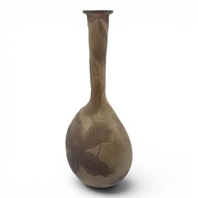 a vase with a bird design on it on a white background