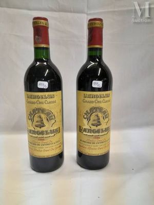 two bottles of wine sitting next to each other on a table