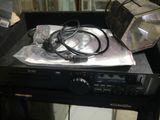 a picture of a remote control sitting on top of a dvd player