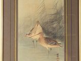 tableau représentant un oiseau volant au-dessus d'un plan d'eau, dans un cadre