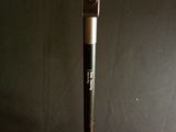 a baseball bat sitting on top of a glass of water