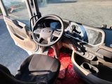 a view of the inside of a bus from the driver ' s seat