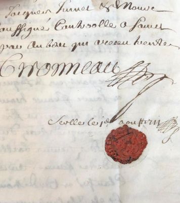 a piece of paper that has a wax seal on it