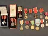 many medals and medals in a case on a table