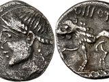 a silver coin with an image of a woman on it