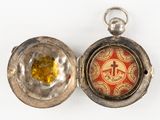 a silver locke with a red and yellow design on it