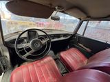 a car with red leather seats and a steering wheel