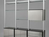 an image of a metal shelf with glass shelves and drawers