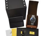 an image of a watch in a black box with a brown leather case