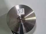 a metal object with a number on it hanging on a wall