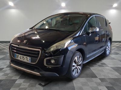 the small black car is parked in a large room