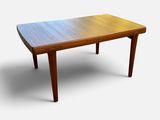 a close up of a table with a wooden top on a white background