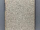 a close up of a book on a table with a white background