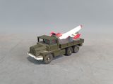 a toy truck with a missile on the back of it