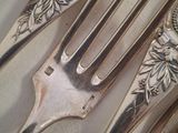 a fork, knife, and spoon sitting on a table