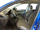 the interior of a blue car with a steering wheel and dashboard