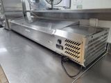 a machine that is sitting on the counter in the kitchen