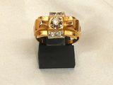 an image of a gold ring with diamonds on it
