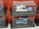 four different models of cars on display in a display case