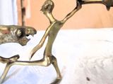 a figurine of a man and a dog on a table