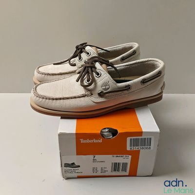 men ' s sperry boat shoes in a box on a table