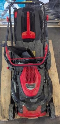 an image of a lawn mower parked in a parking lot