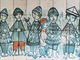 painting of a group of people on a tiled wall in a bathroom