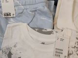 a lot of clothes that are sitting on a table